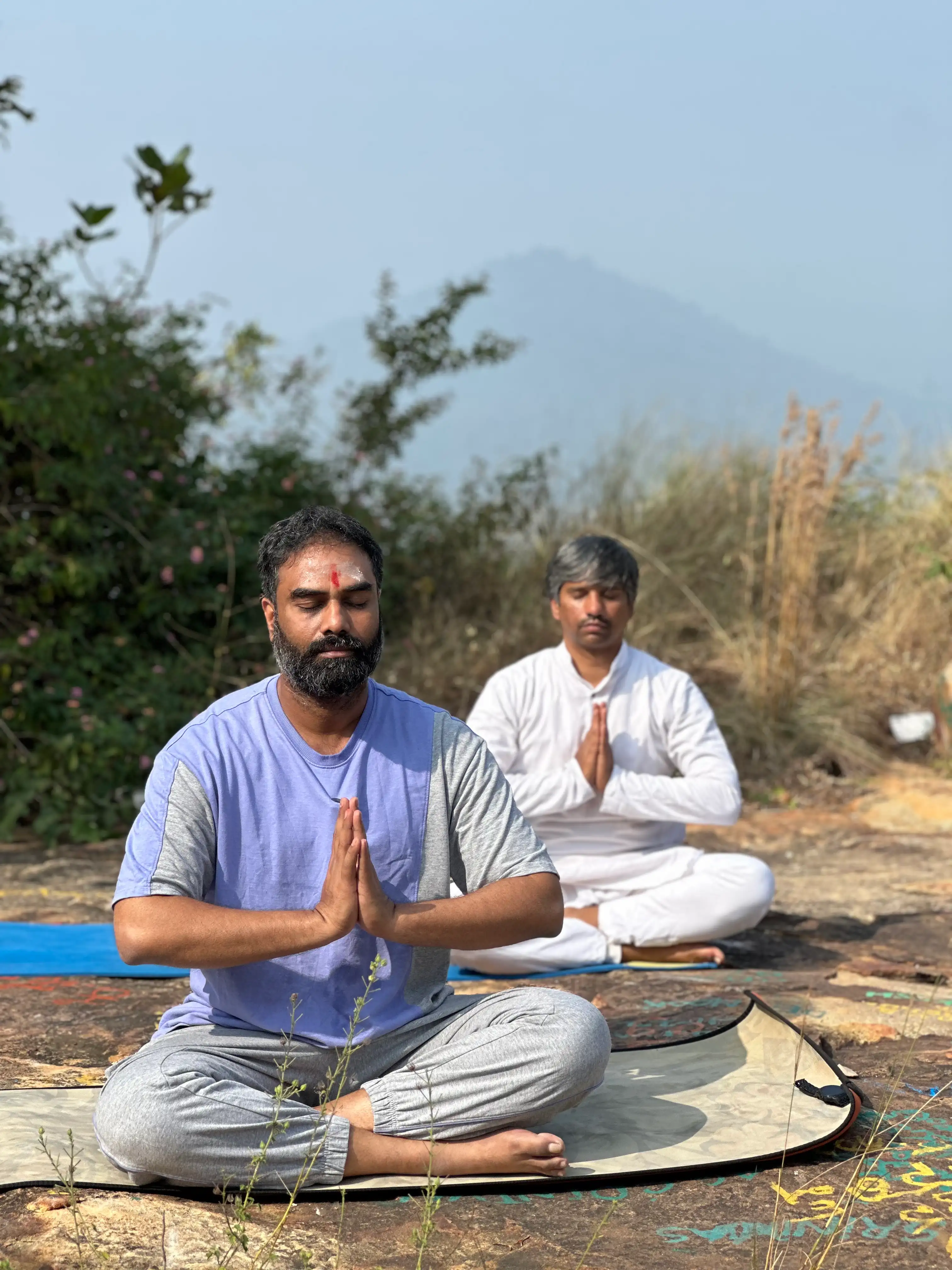 Outdoor group meditation on a hilltop — Navyoga